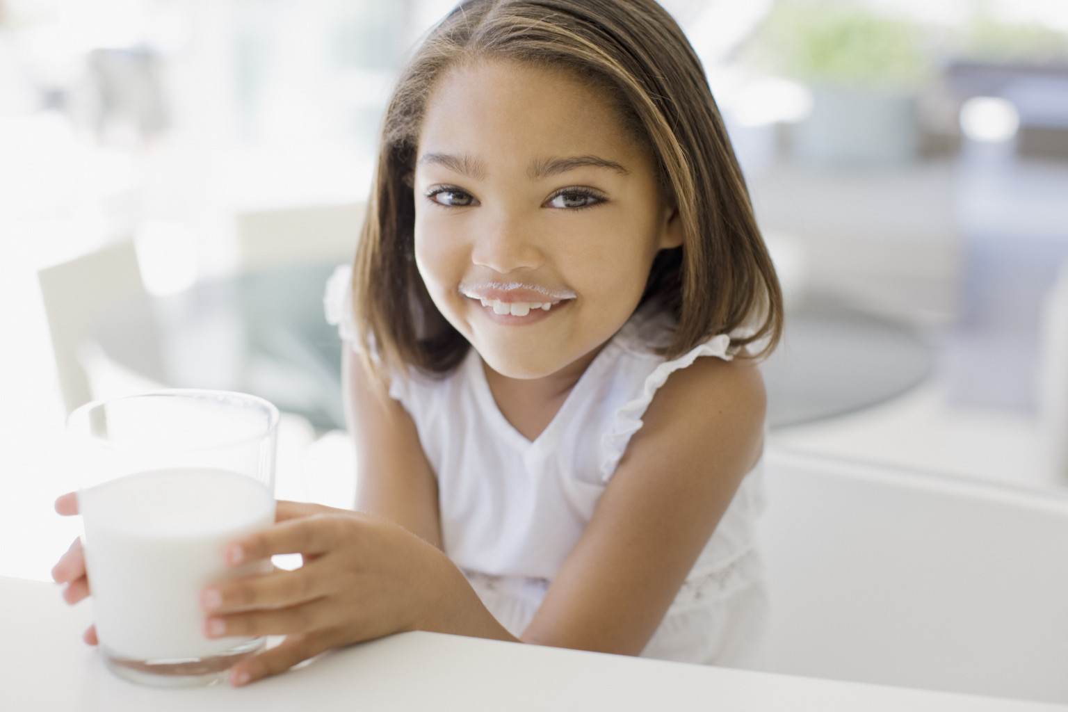 Girl drinking glass of milk